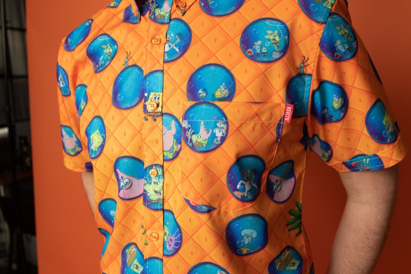 RSVLTS Party In My Pineapple KUNUFLEX Short Sleeve Shirt in Orange — front view
