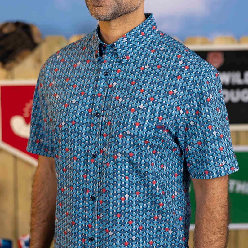 RSVLTS 8-Bit Bleachers KUNUFLEX Short Sleeve Shirt in Blue — front view