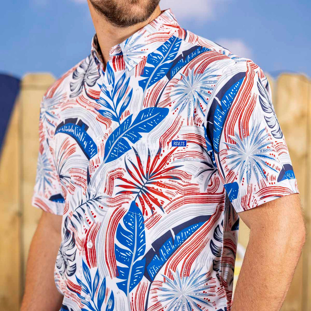 RSVLTS Palms Bursting in Air KUNUFLEX Short Sleeve Shirt in Blue — front view
