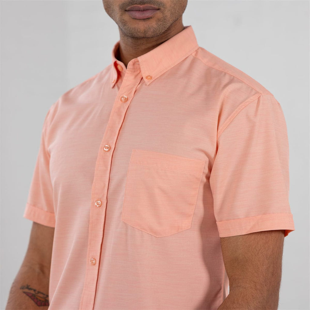 RSVLTS Peach Chaos KUNUFLEX Short Sleeve Shirt in Orange — front view