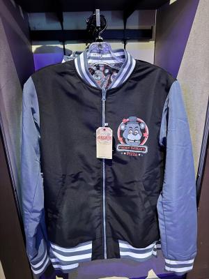 RSVLTS Freddy Fazbear’s Pizza Reversible Bomber Jacket in Black — front view